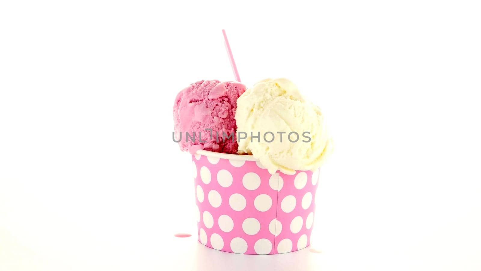 Ice cream scoop in paper cup on white background.