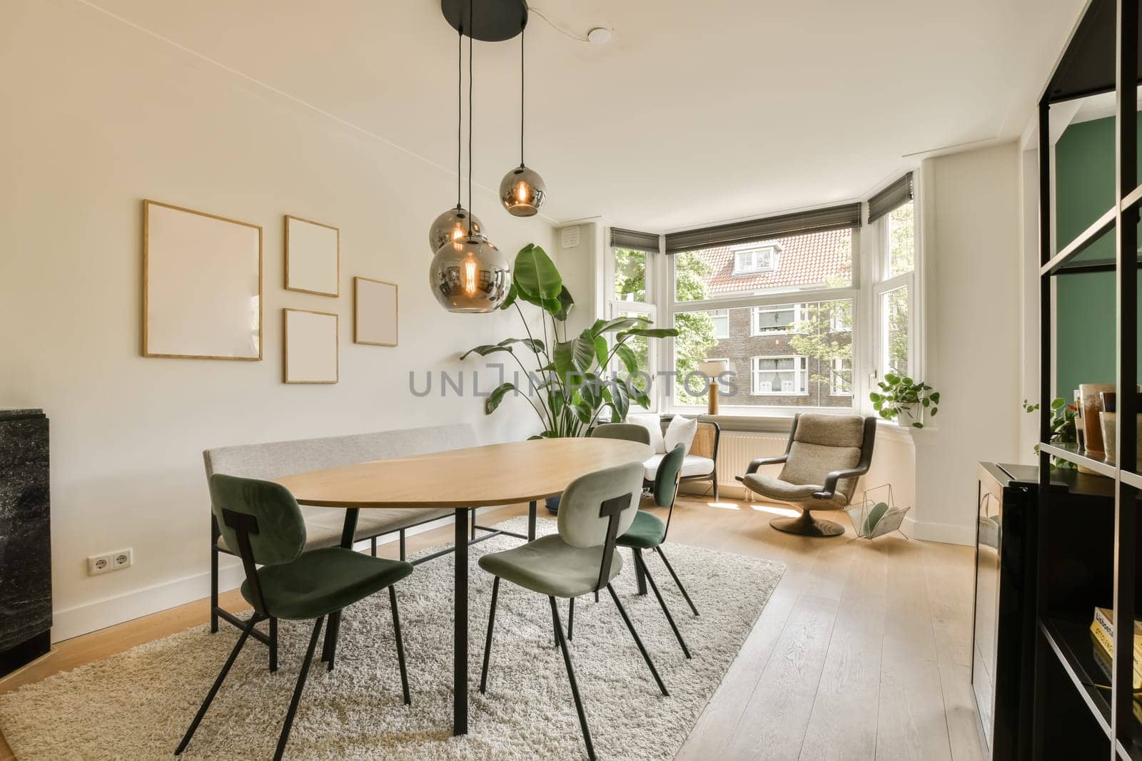 a dining room with green chairs and a white rug on the floor in front of the table is an open fire place