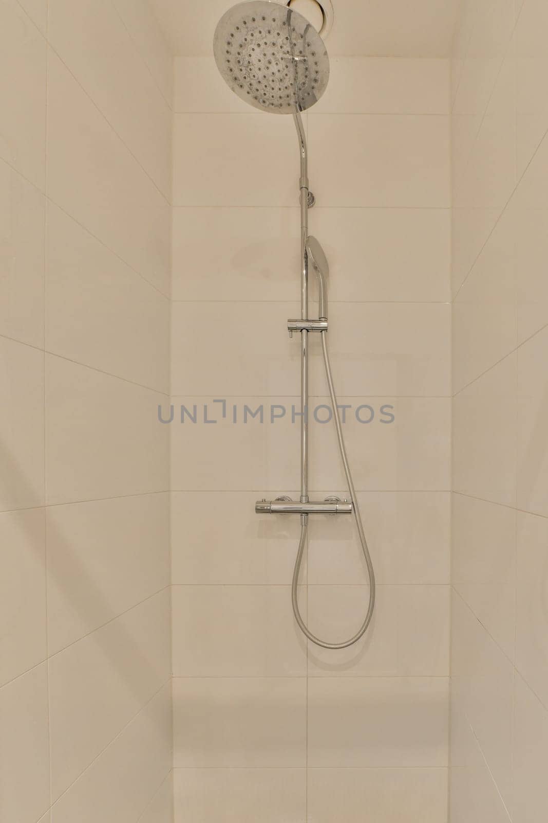 a shower that is very clean and ready for you to use in the bathroom or on the other side of the wall