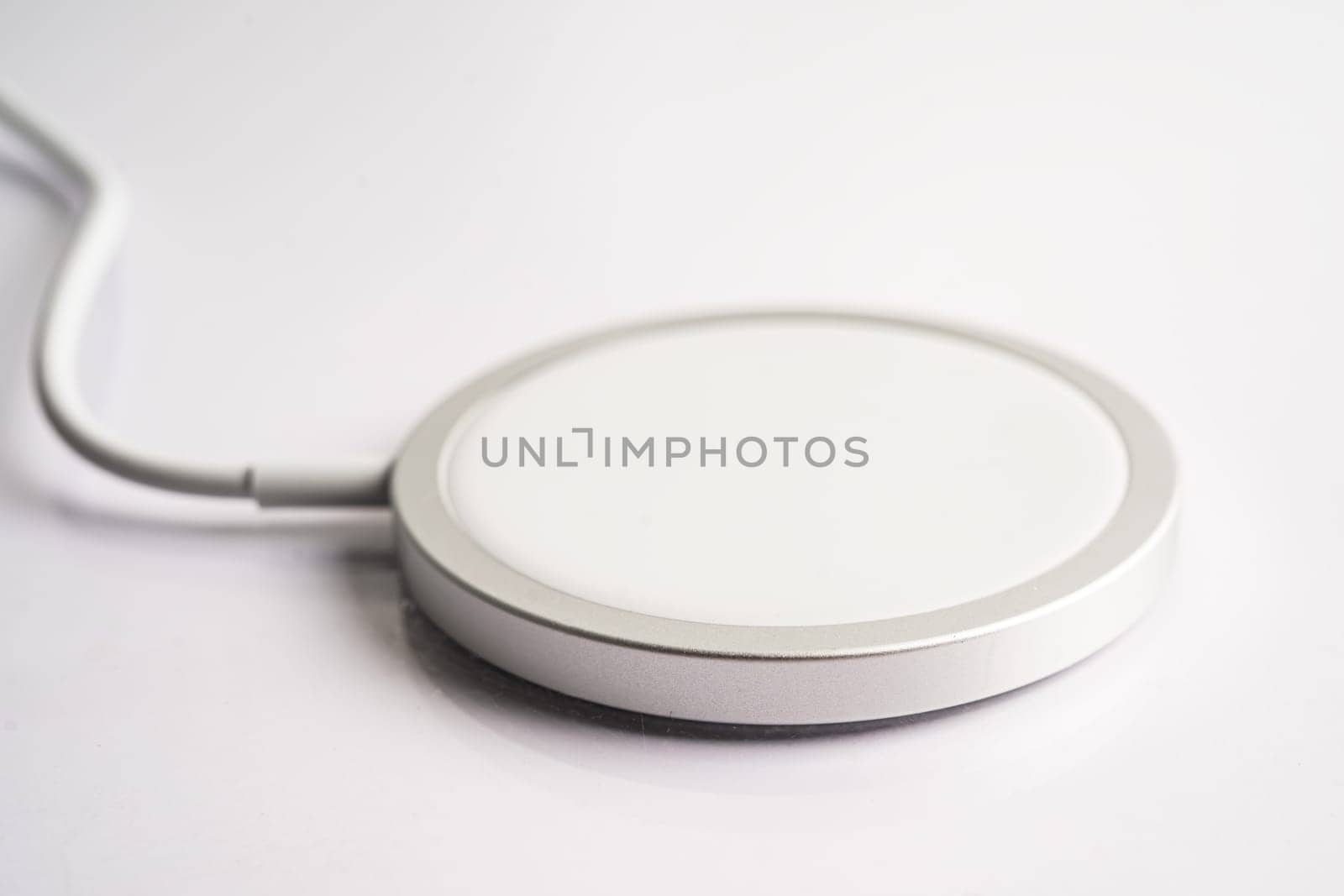 Wireless charger, magnetic charging modern equipment of mobile phone. by pamai
