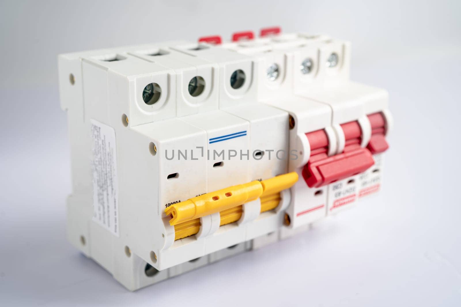 Automatic circuit breaker on white background, control and protect electrical power system. by pamai