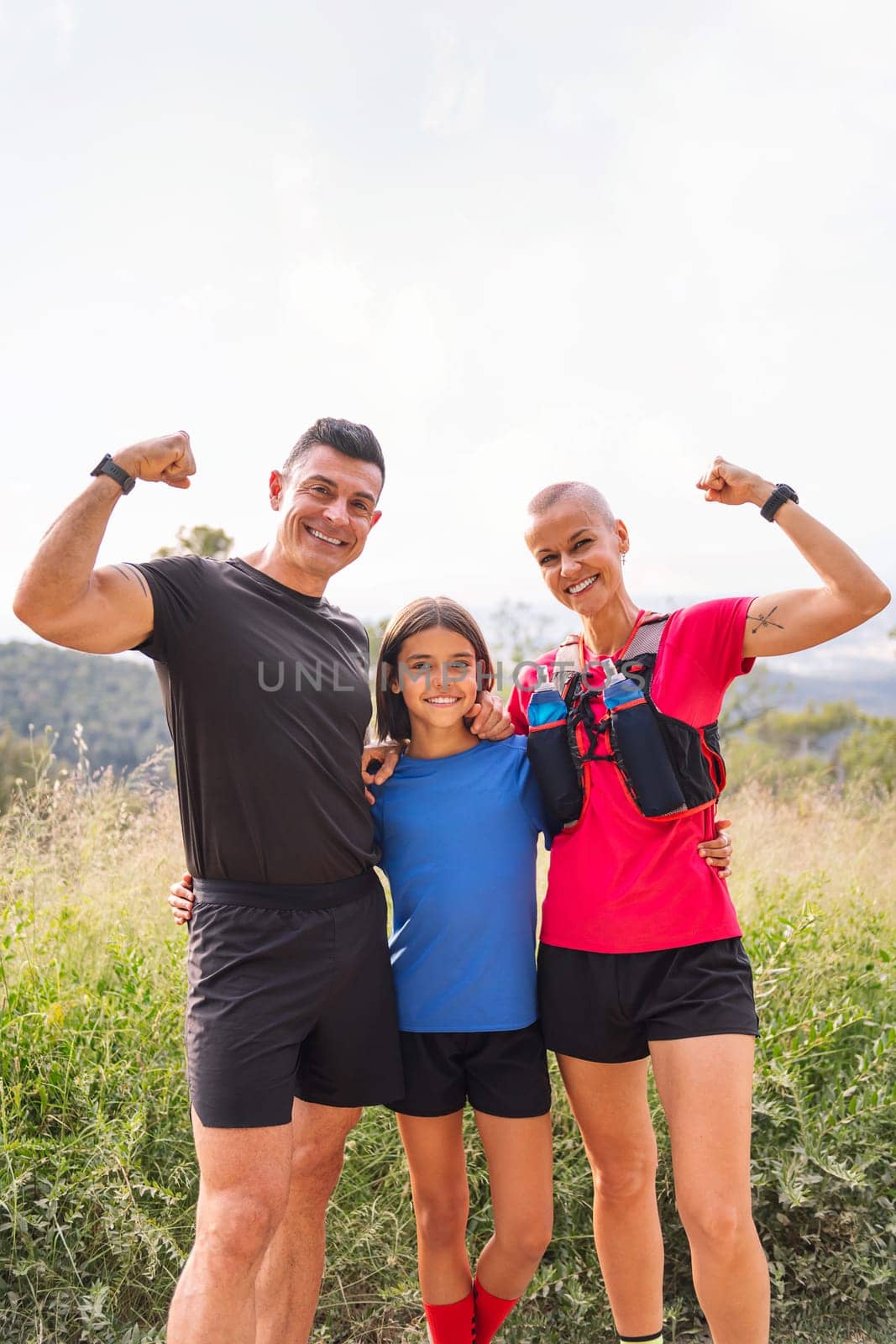 sports family smiling happy after doing sport by raulmelldo