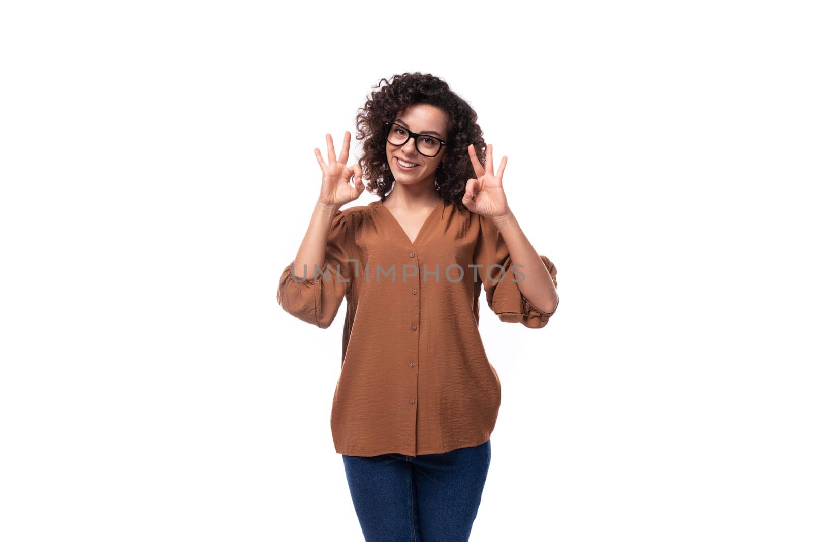 young confident successful curly leader woman wearing brown blouse by TRMK