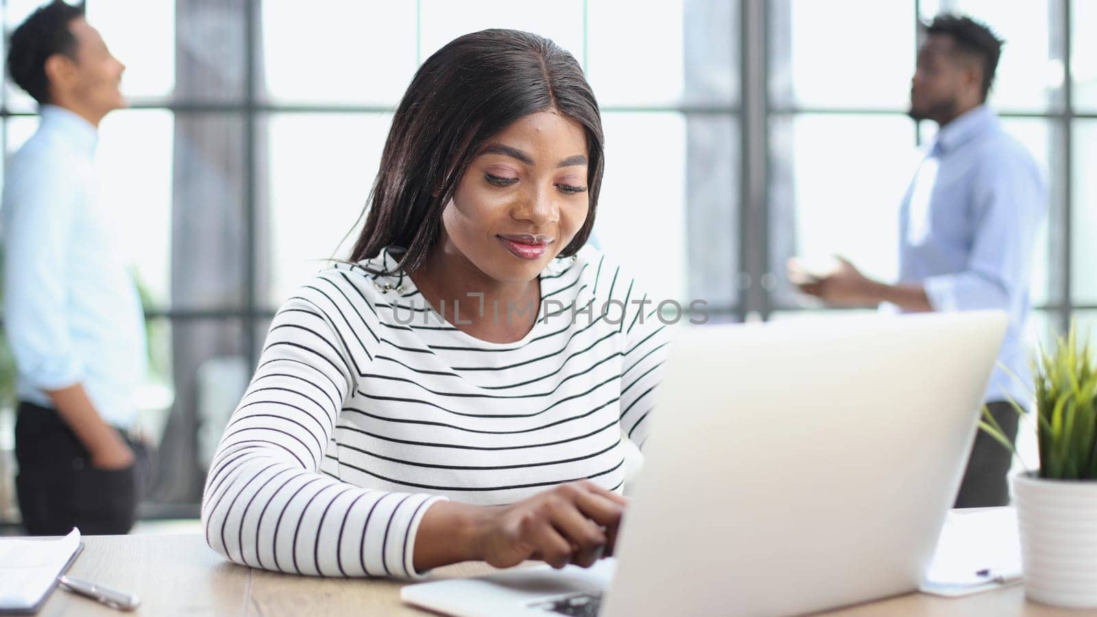 Attractive Businesswoman at Office Desk