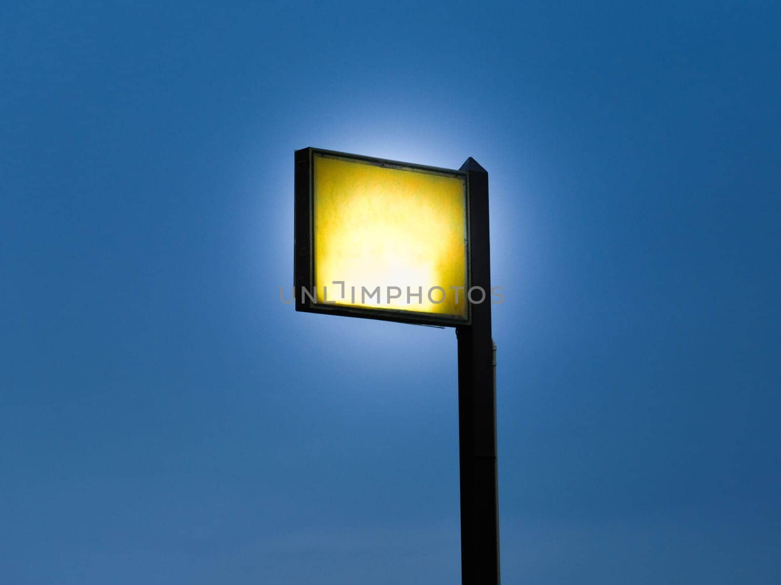 Spotlights tower with blue sky background.