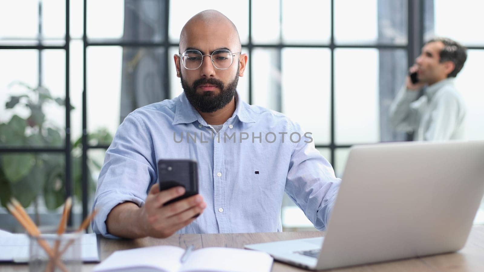 man working on the table with laptop in a new office