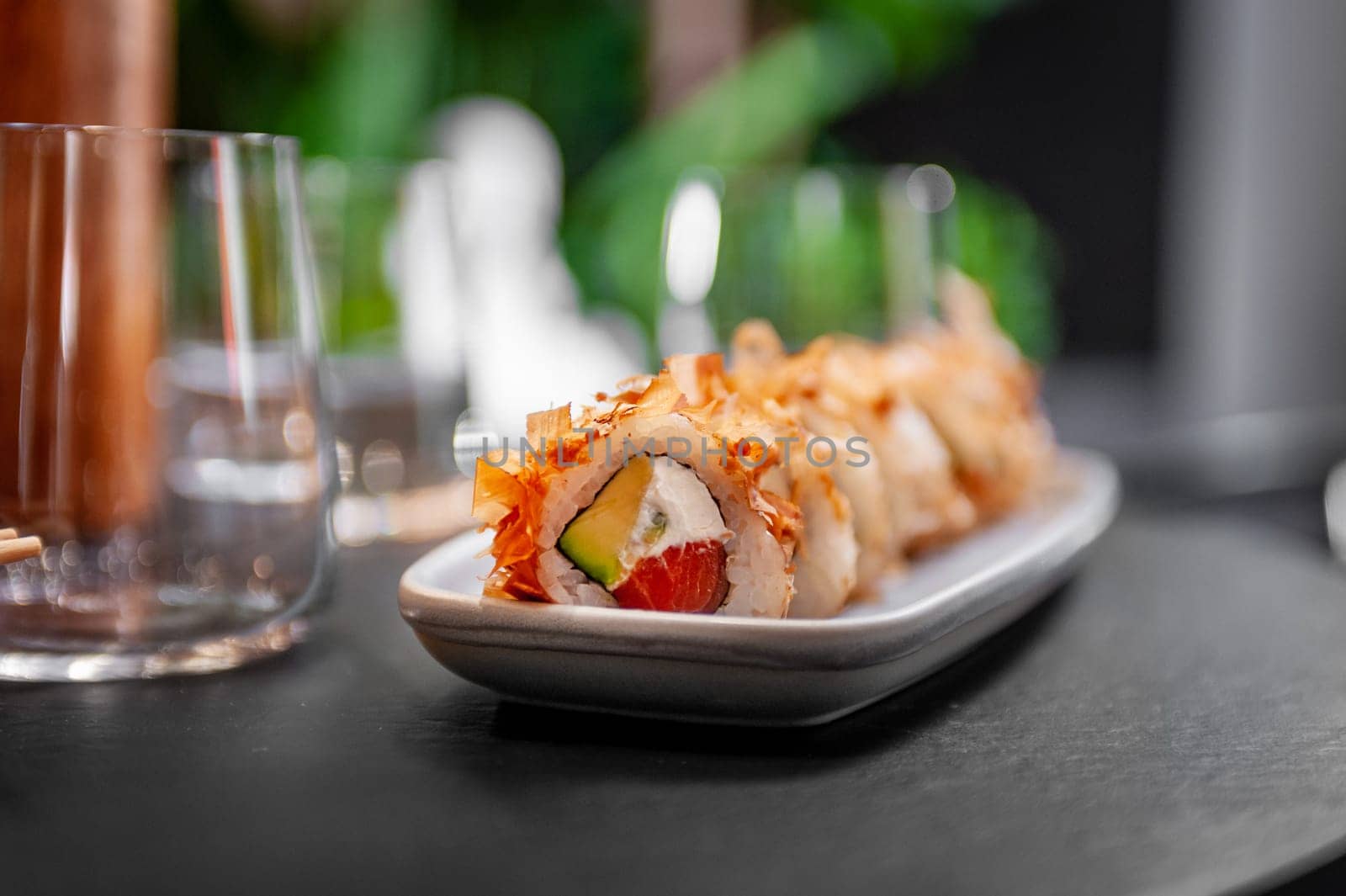 Classic Bonito sushi roll set with tuna flakes, salmon and avocado. Japanese dish of fresh salmon and rice. High quality photo