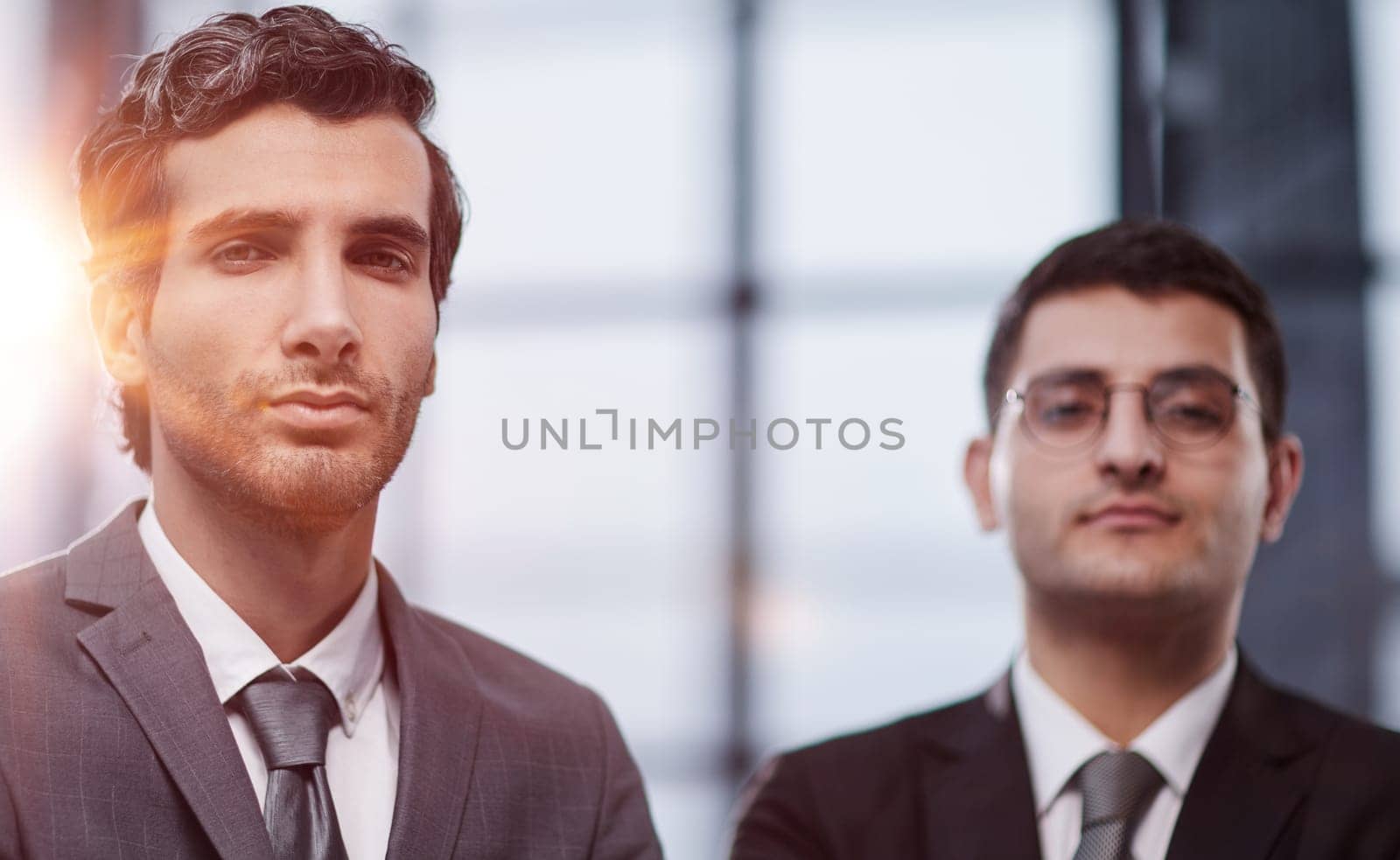 Two men business workers standing with arms crossed gesture at office