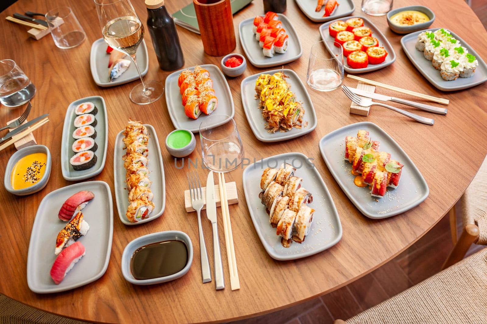 A set of sushi rolls on a table in a restaurant. High quality photo.