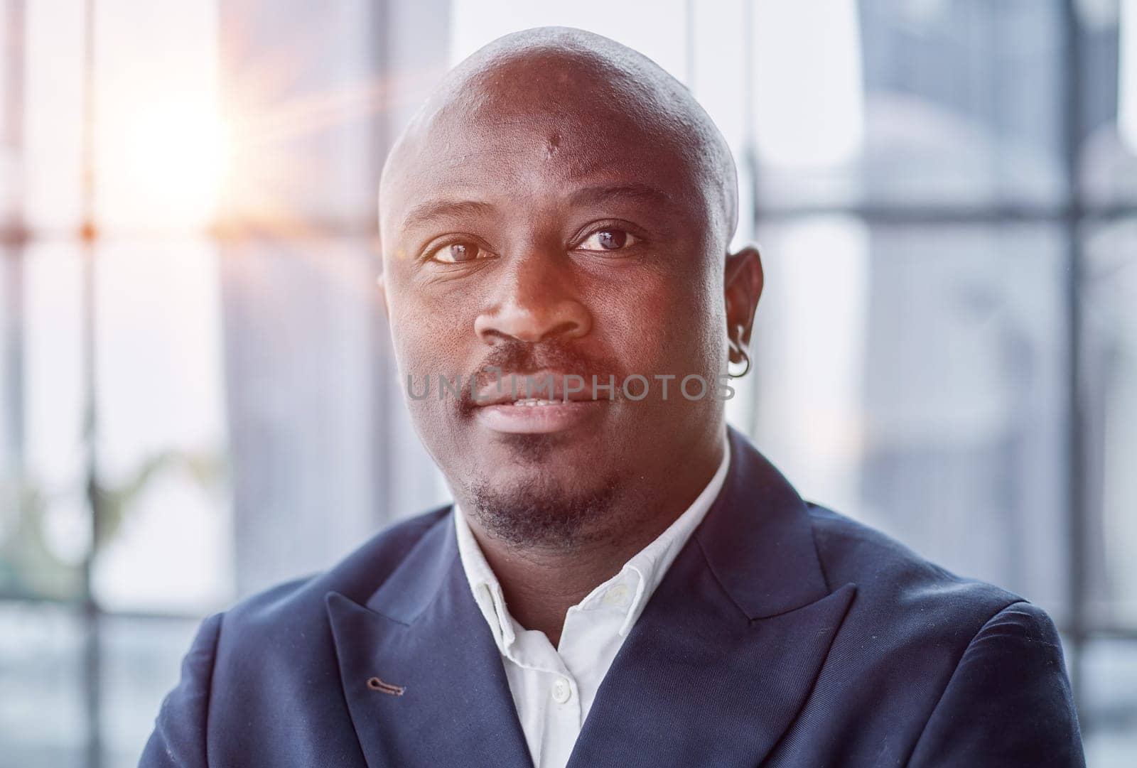 Handsome african american executive businessman in the office close up