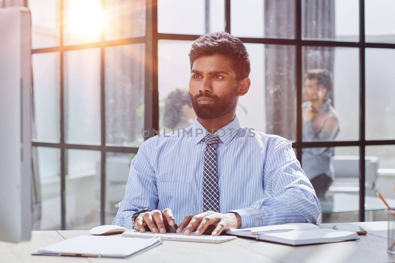 Stylish designer at work sitting. Focused on his job