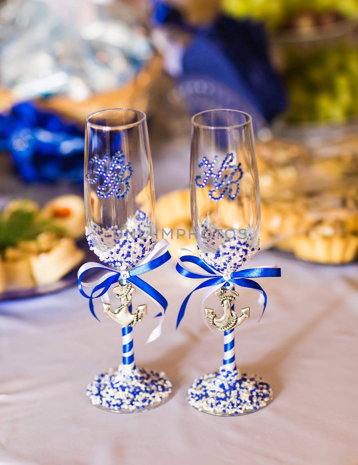 decorated glass of champagne. Two wedding glasses
