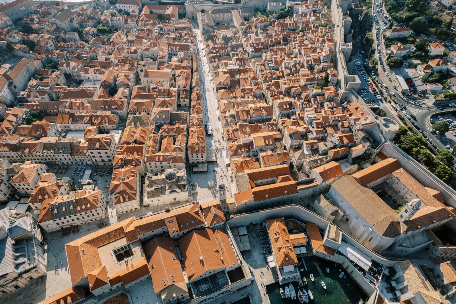 Red tiled roofs of ancient stone houses. Dubrovnik, Croatia. Top view by Nadtochiy