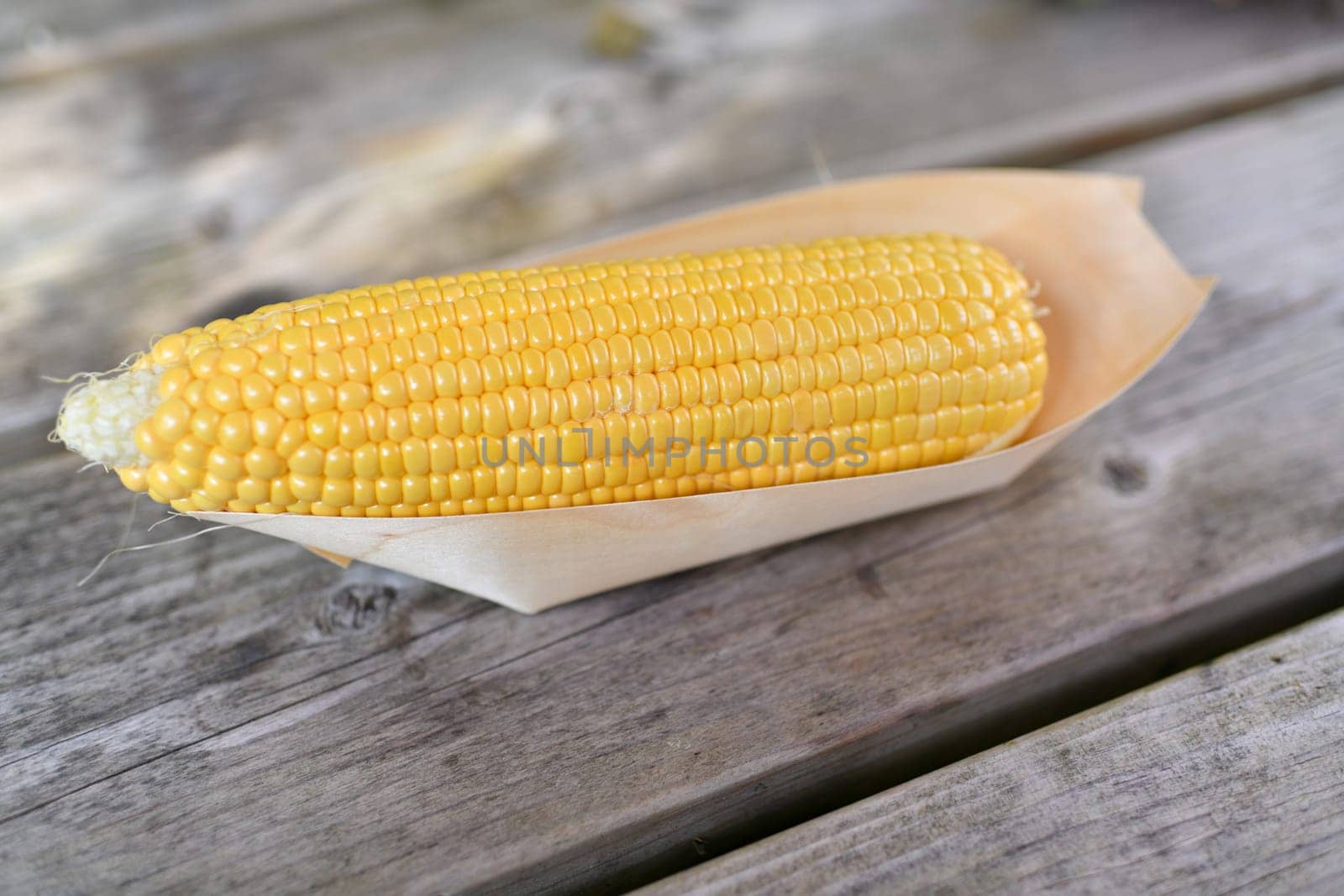 Corn in a wooden barbecue box