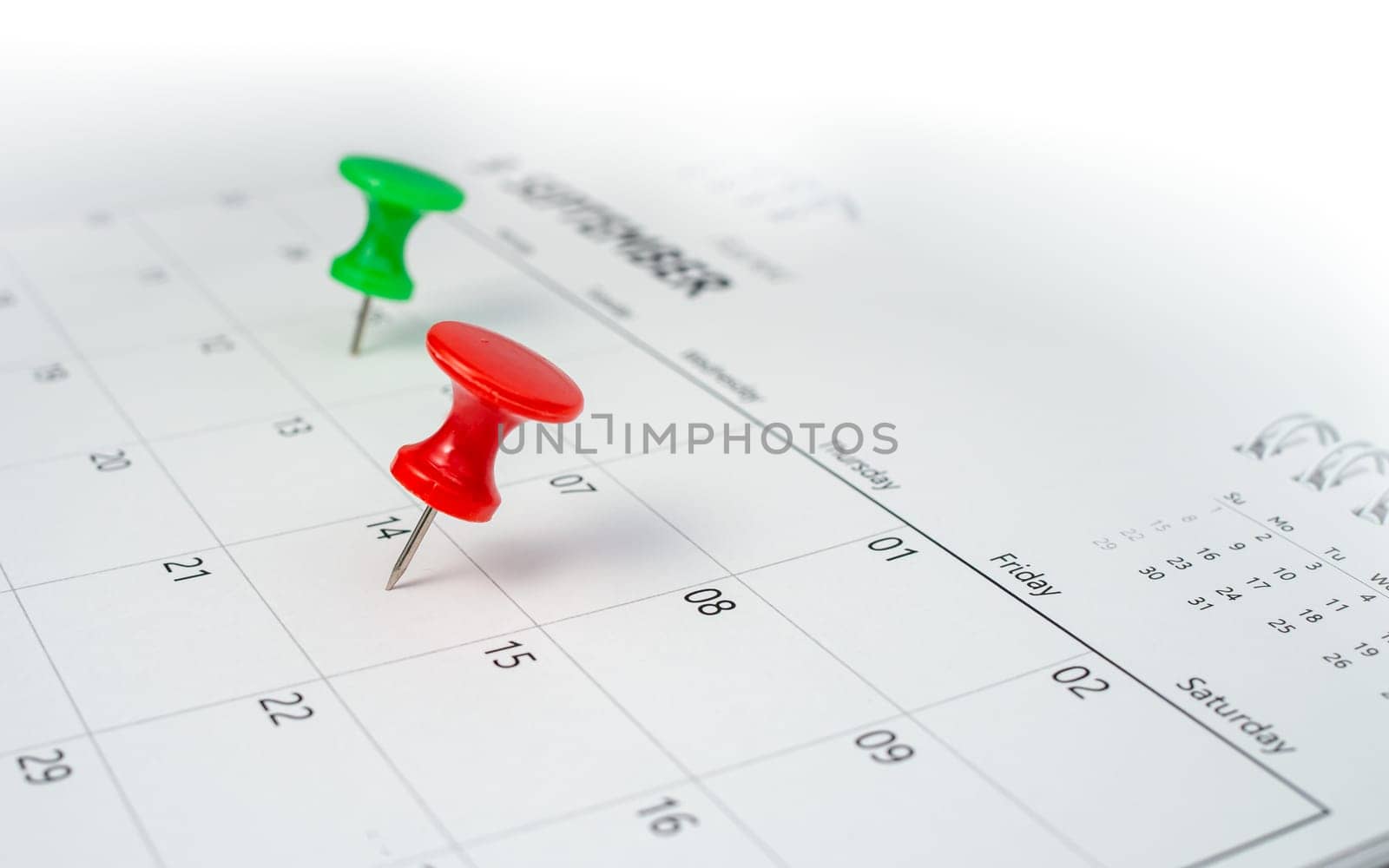 Pinning to the calendar It represents appointments, meeting reminders, planning for business meetings and travel planning concepts. by Unimages2527