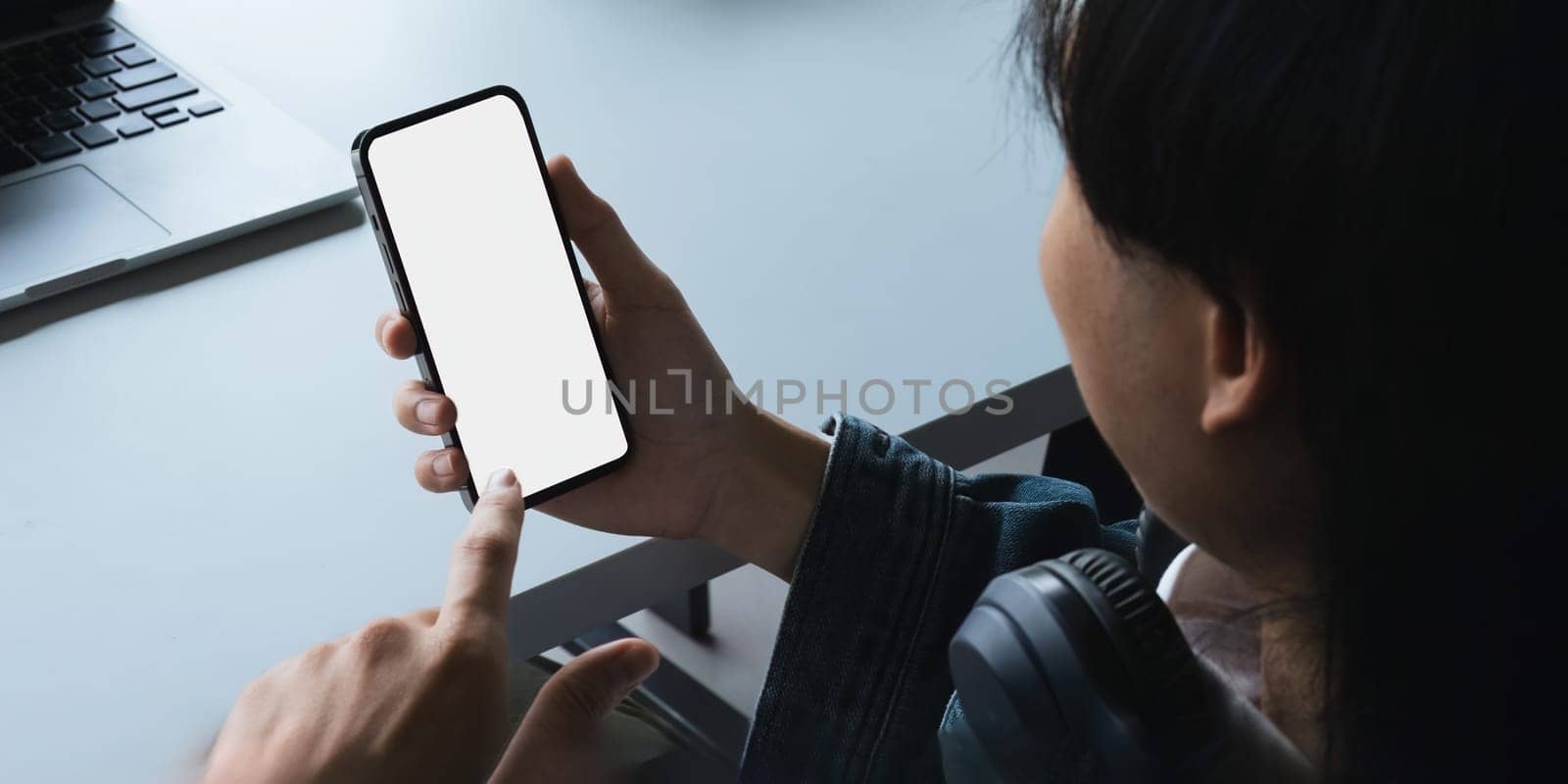 man using mobile smartphone and device white screen empty space smart phone.