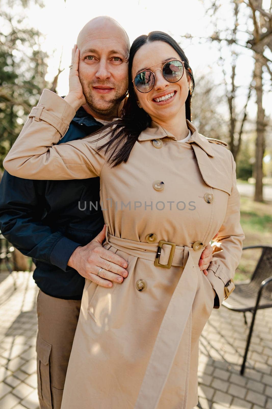 Happy romantic couple enjoying a walk in the park by Fabrikasimf