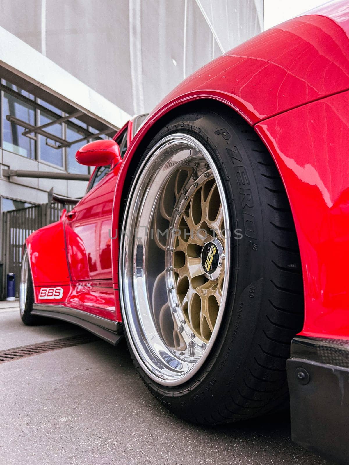 Fragment of a Red sport car, wheels BBS disk Close up