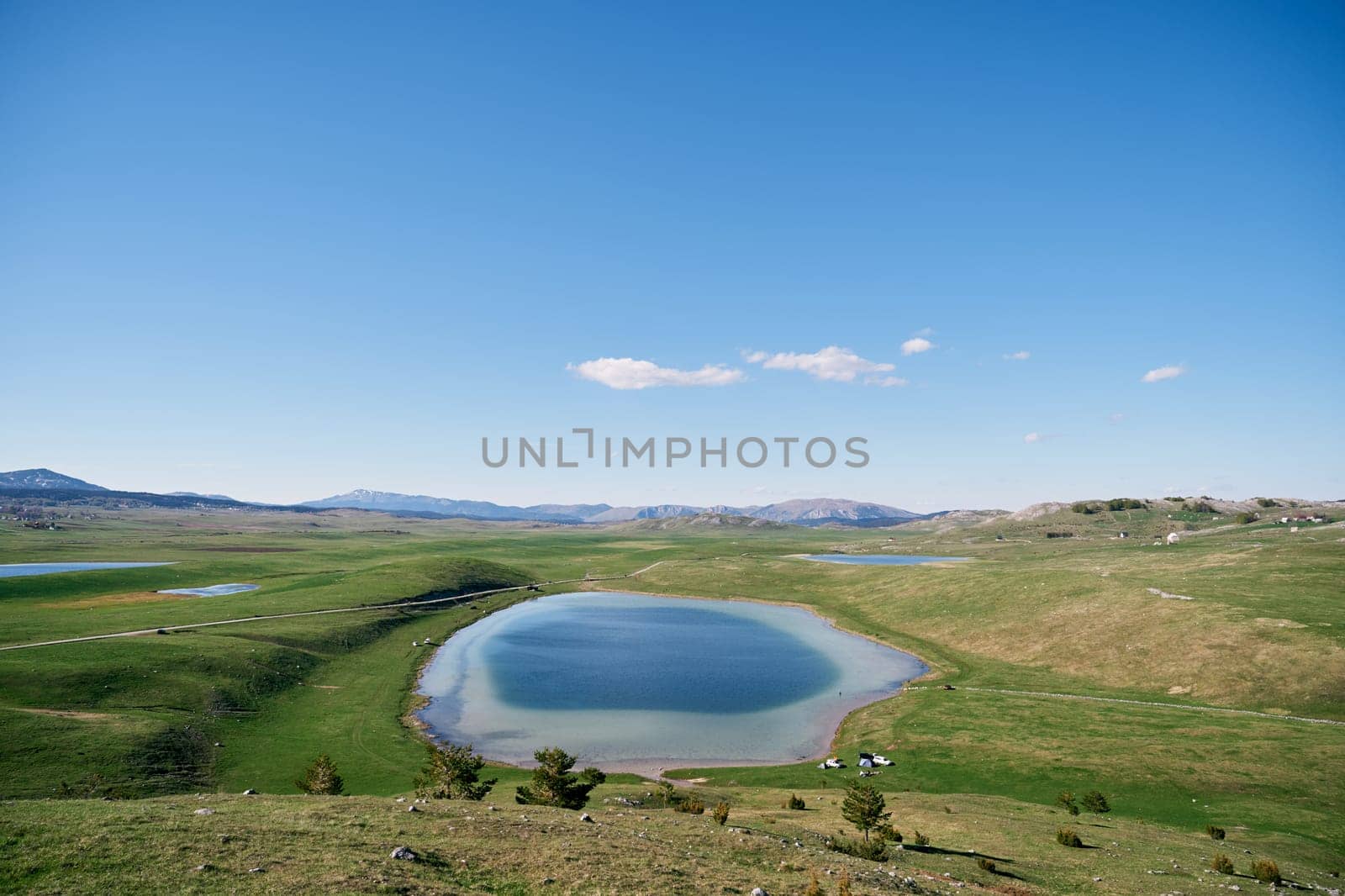 Blue Devil Lake in a green valley in Durmitor National Park. Montenegro. High quality photo