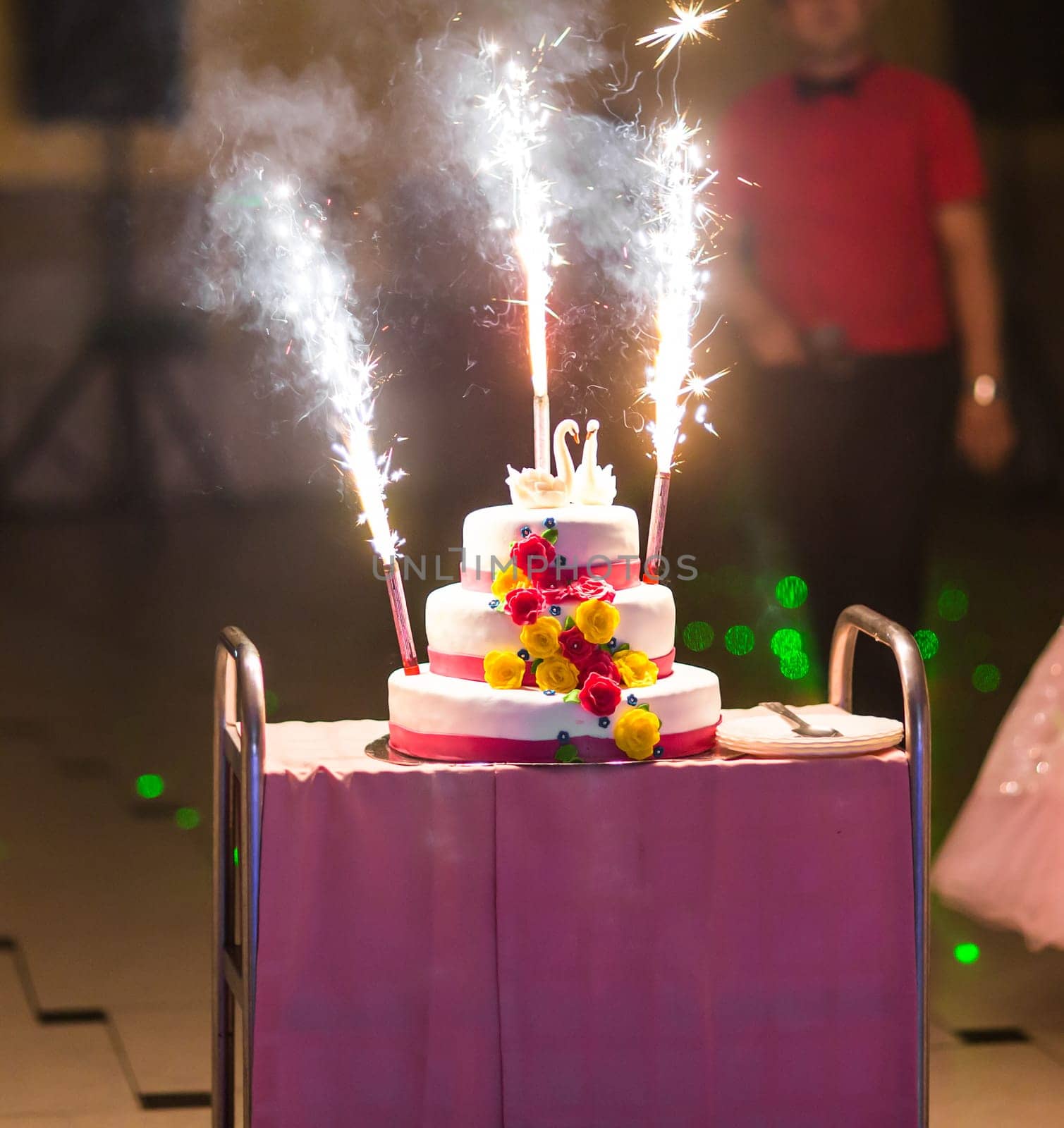 A traditional and decorative wedding cake at wedding reception.