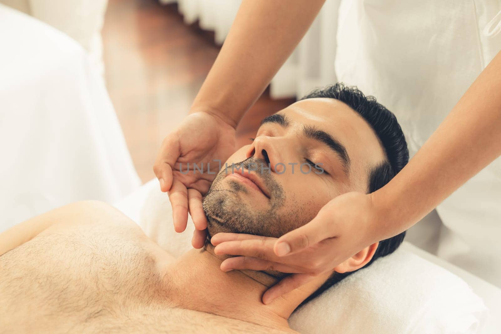 Caucasian man enjoying relaxing anti-stress head massage. Quiescent by biancoblue