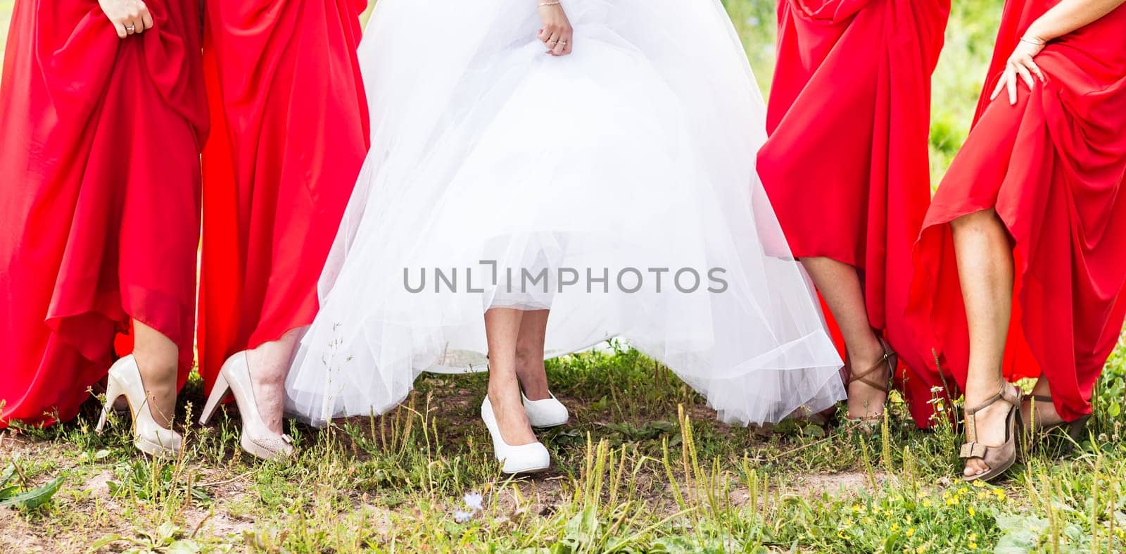 Bride and bridesmaids legs. Wedding party. Wedding guests