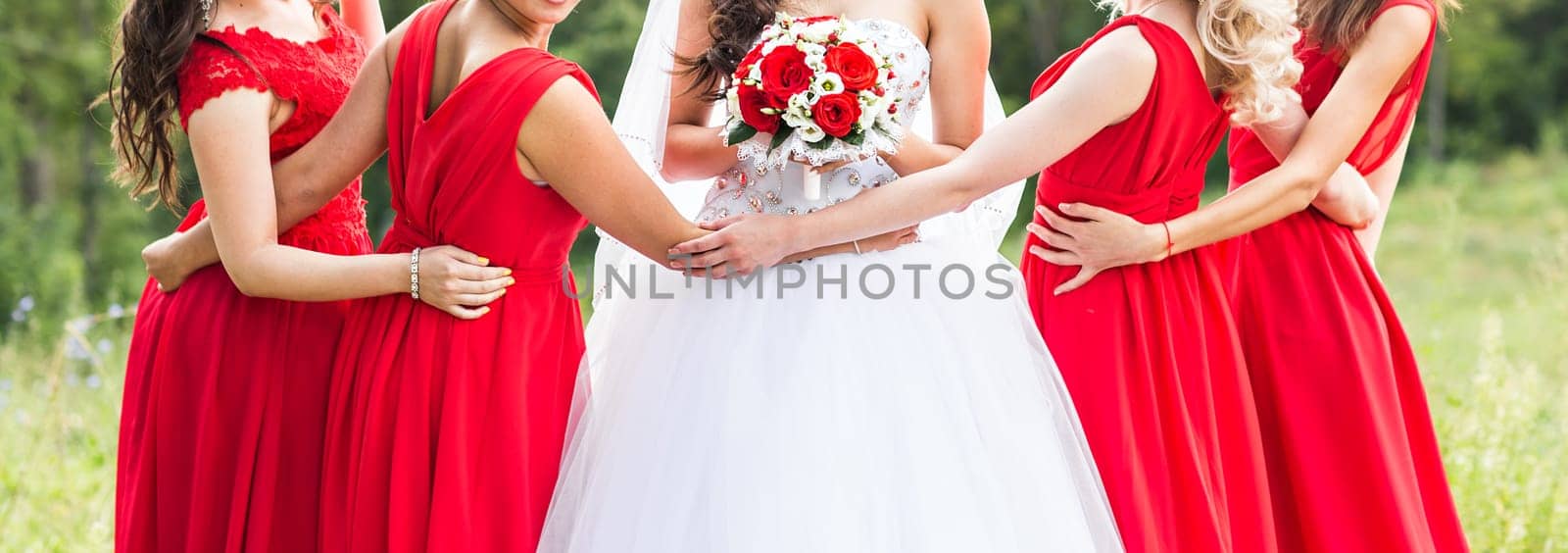 Bride with bridesmaids on the park in wedding day by Satura86