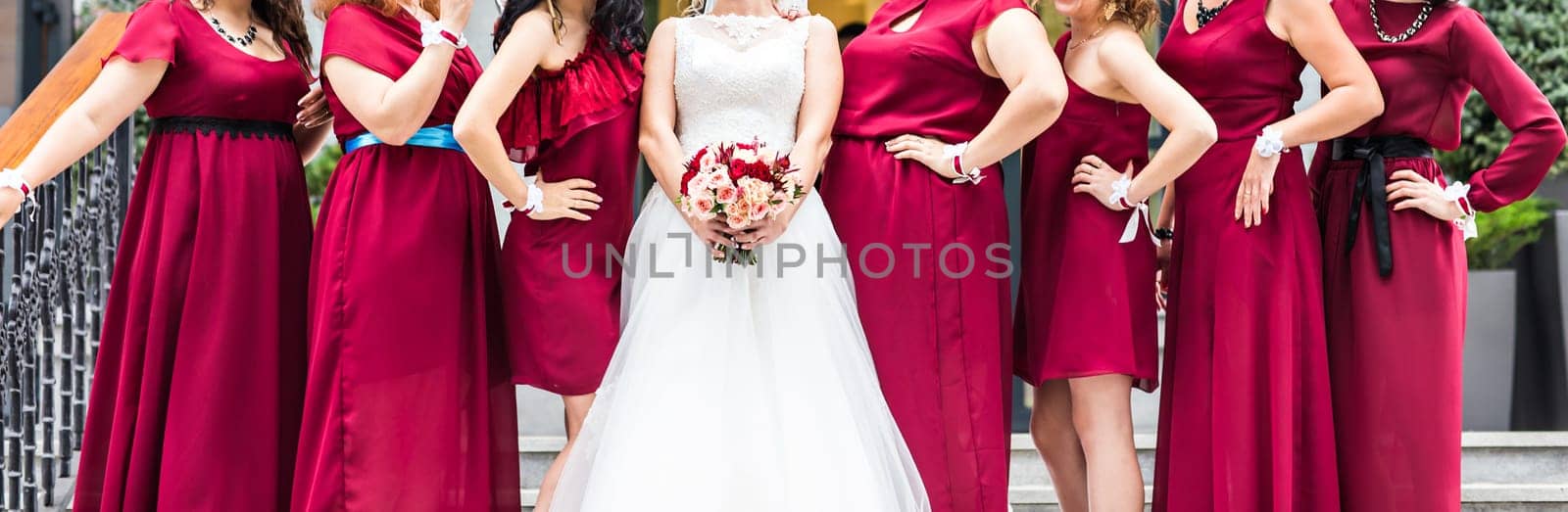 Bride with bridesmaids on the park in wedding day by Satura86