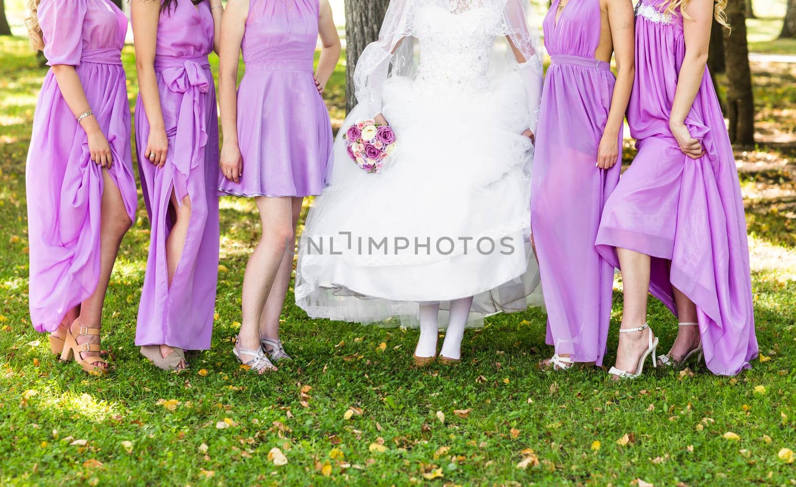 Bride and bridesmaids legs. Wedding party. Wedding guests