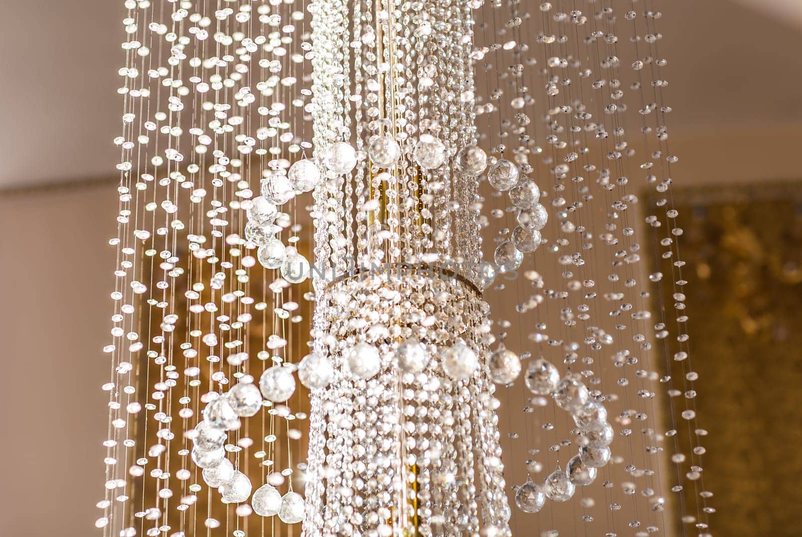 Close-up of a beautiful crystal chandelier. beautiful crystal chandelier in a room