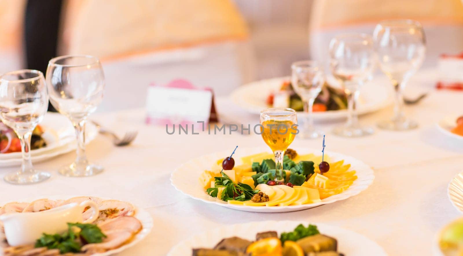 cheese plate on festive table. Tasty appetizer