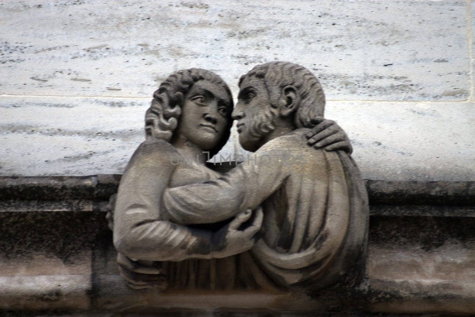 A curious gargoyle or grotesque sculptures on historic university buildings in Oxford, UK.