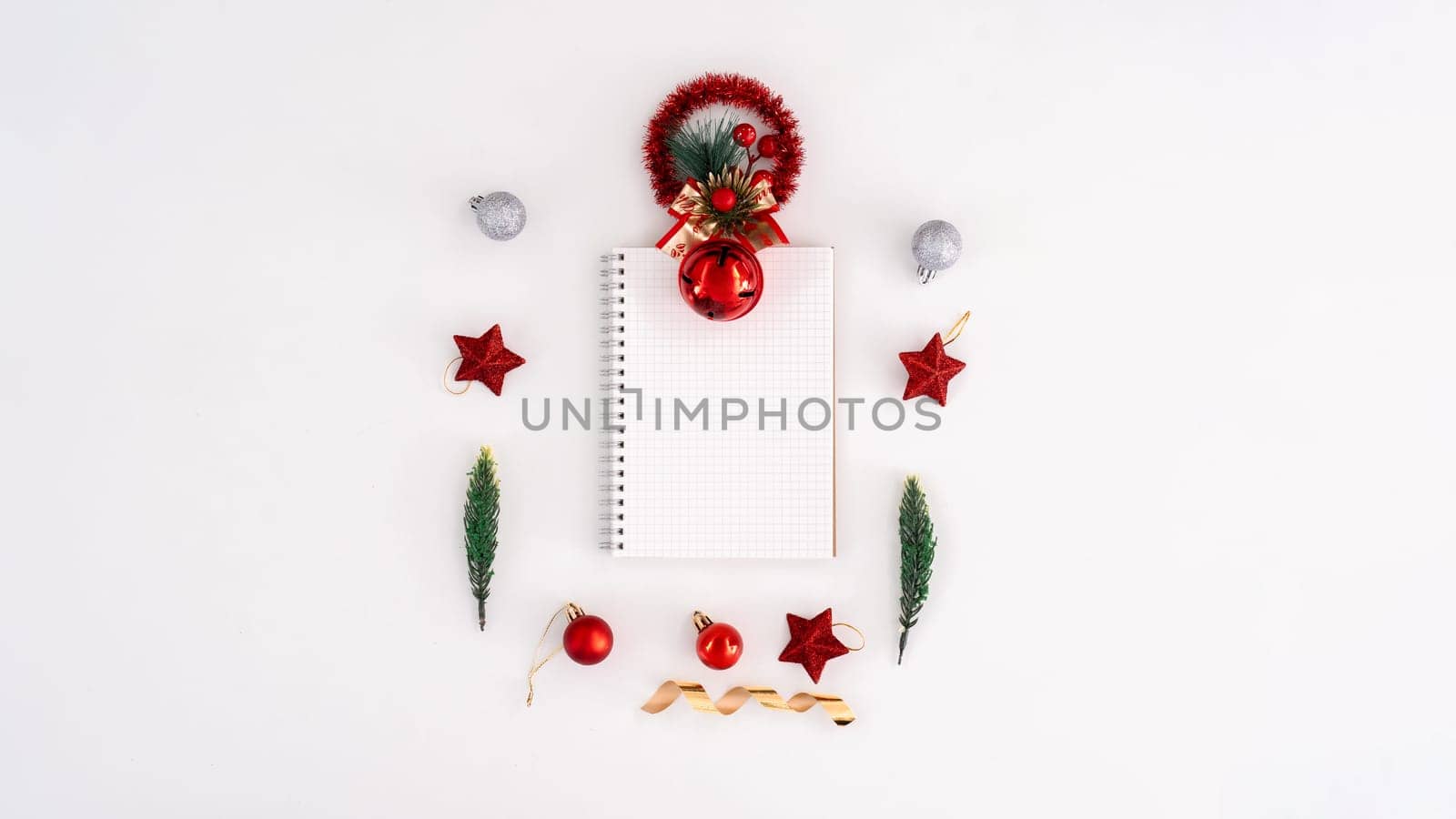 Christmas blank greeting card mock-up scene. Creative layout made of Christmas tree branches with paper card note. Flat lay. Nature New Year concept.