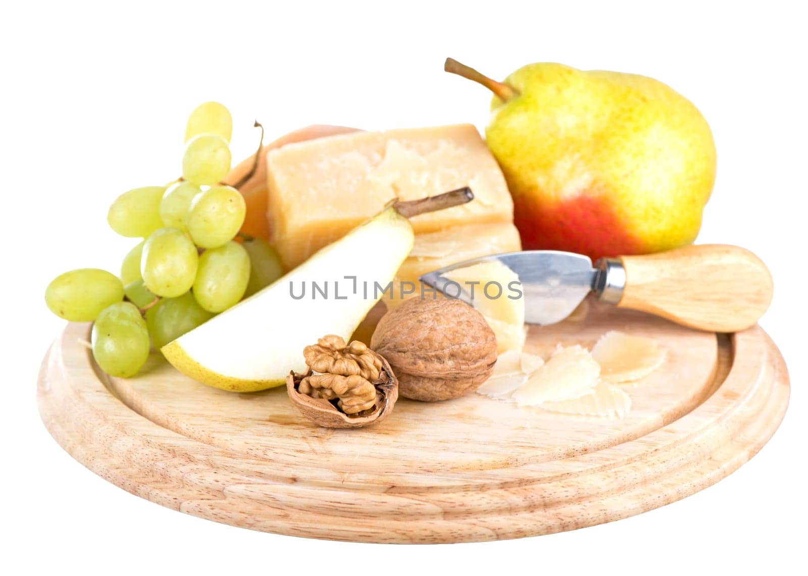 parmesan cheese, nuts and ripe pears on a wooden board on a white background by aprilphoto