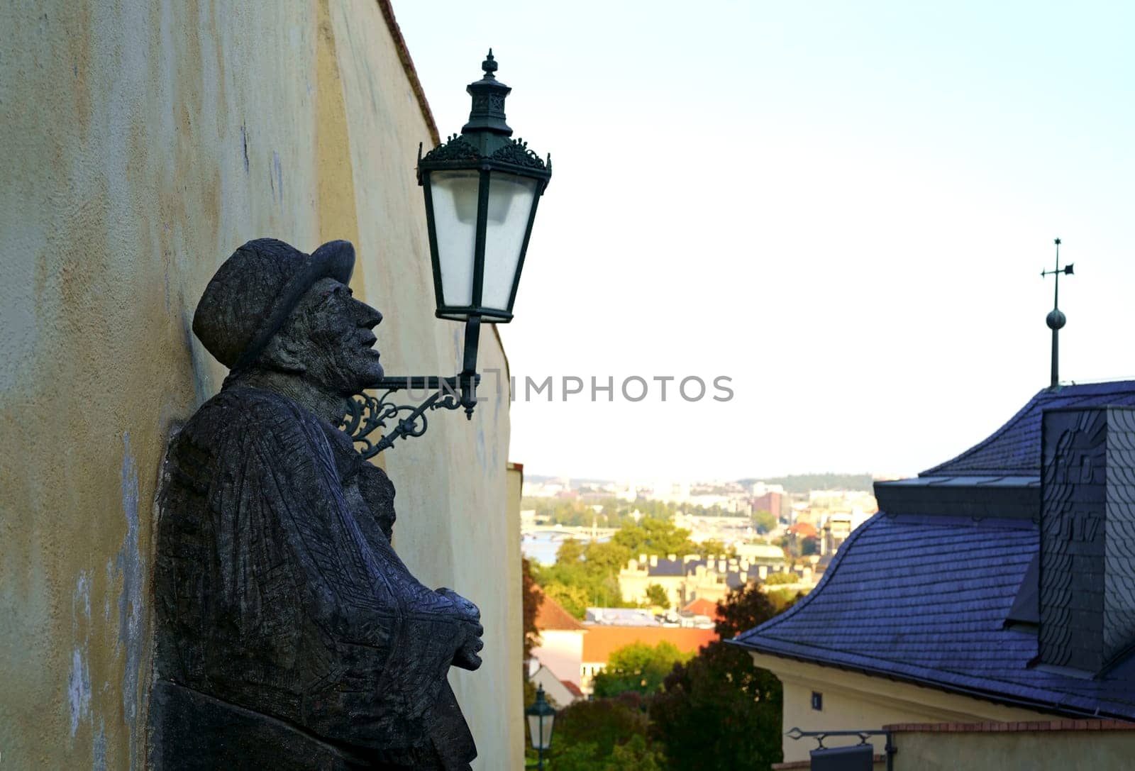 Statue of a man playing guitar at the Prague city