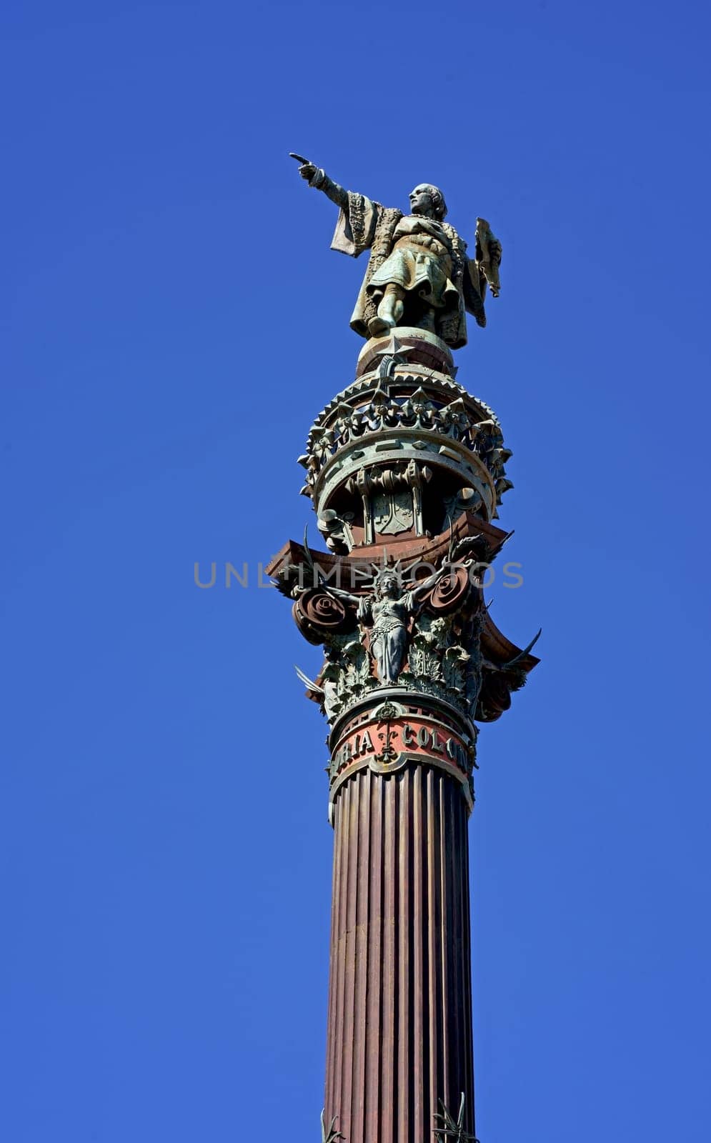 Monument of Christopher Columbus in the harbor of Barcelona against the blue sky, Catalonia, Spain.