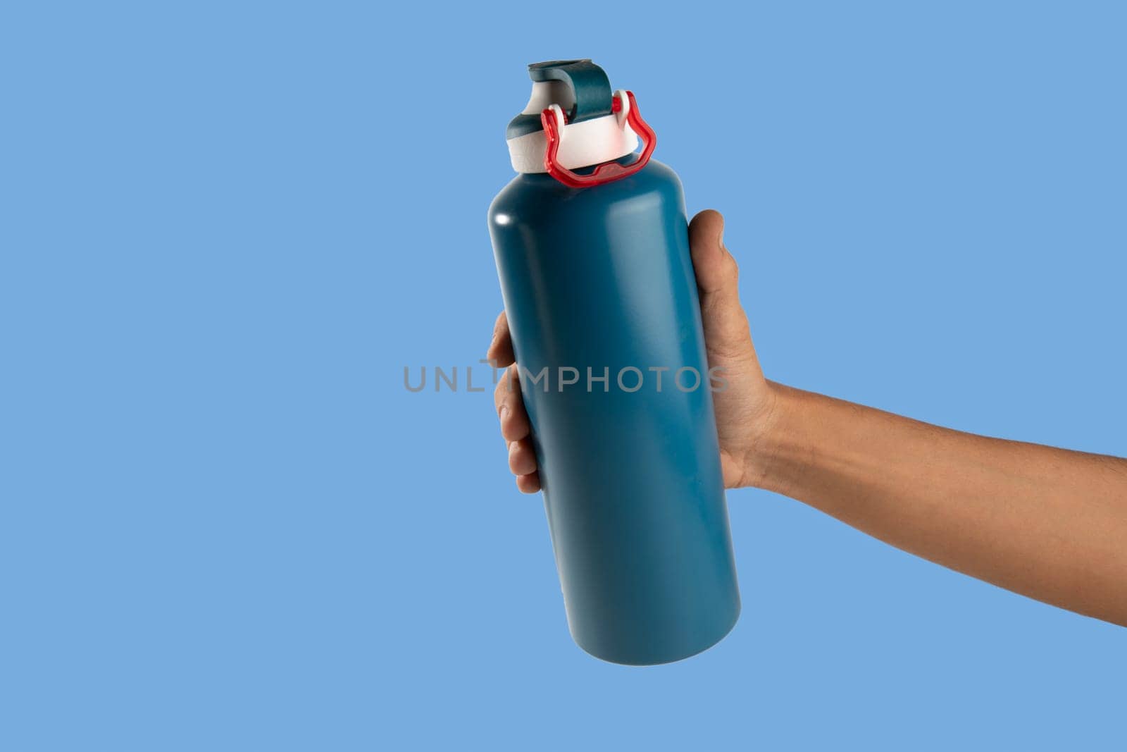 Black male holding thermo bottle canteen on light blue background by TropicalNinjaStudio