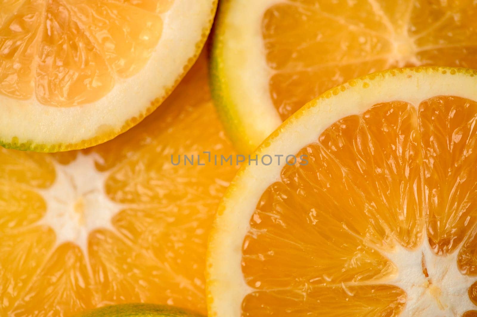 sliced ​​orange laid out on the table as a food background