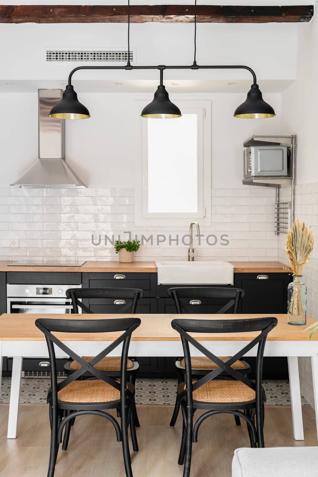 Furnished kitchen area with appliances and furniture by apavlin