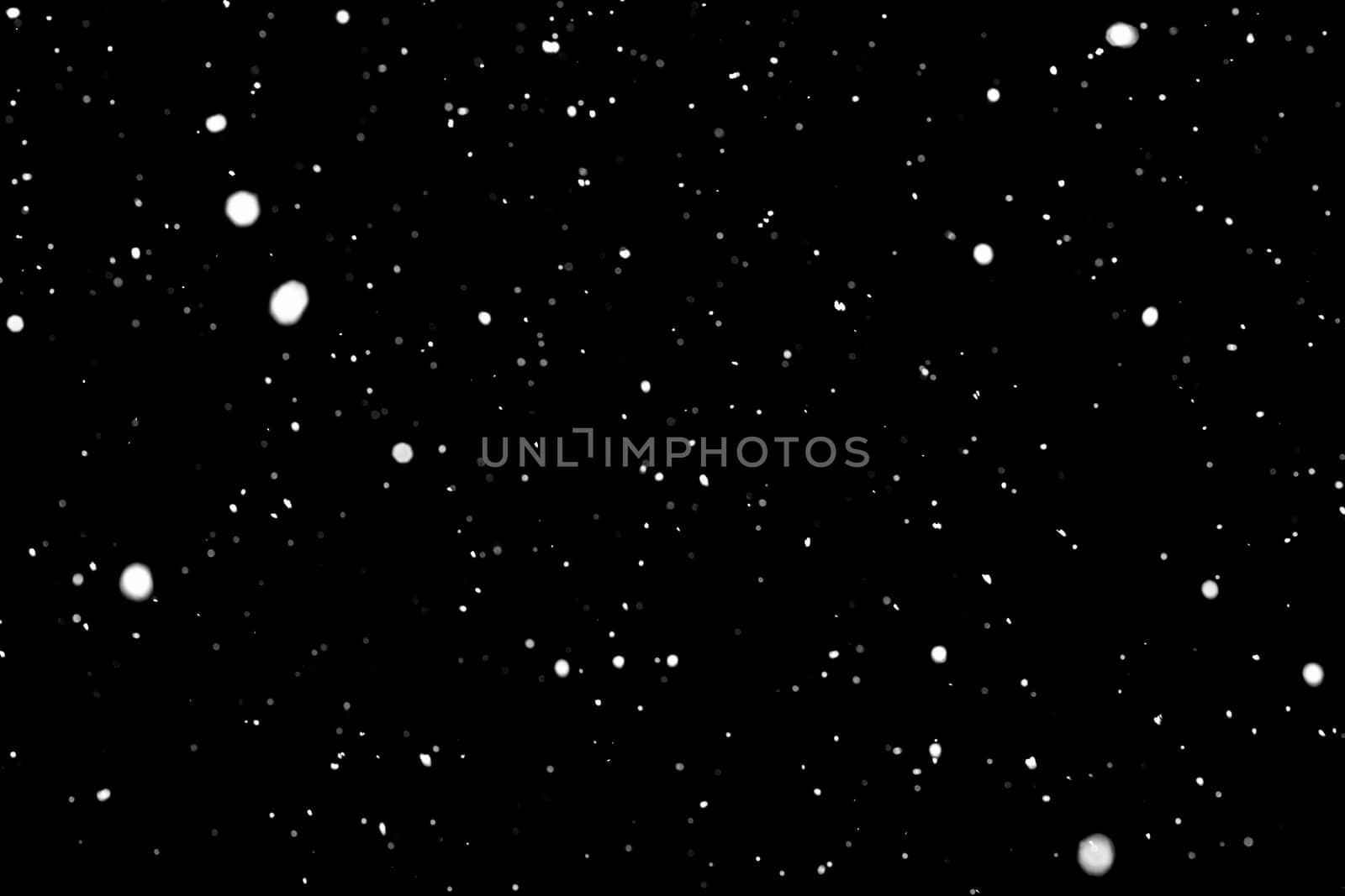 Testura of falling snow on a black background.