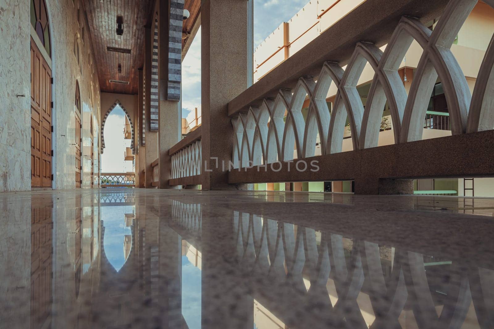Bangkok, Thailand - 05 Jan, 2022 - Diminishing perspective interior view of the corridor at balcony of the building beautiful mosque. Mosque architecture and art concept, Space for text.