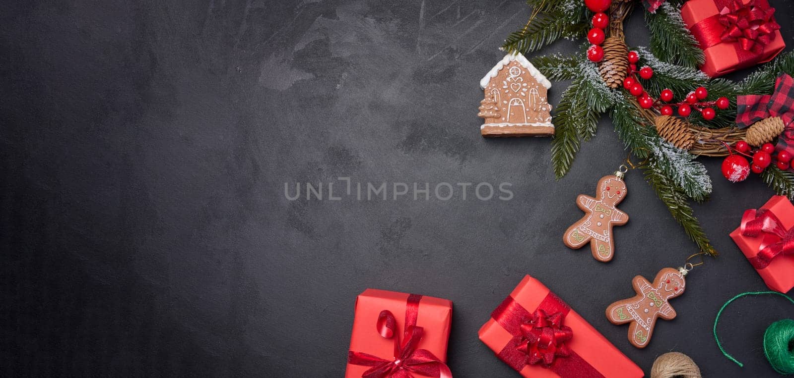 Christmas decor, gift red boxes on a black background, top view. Place for inscription