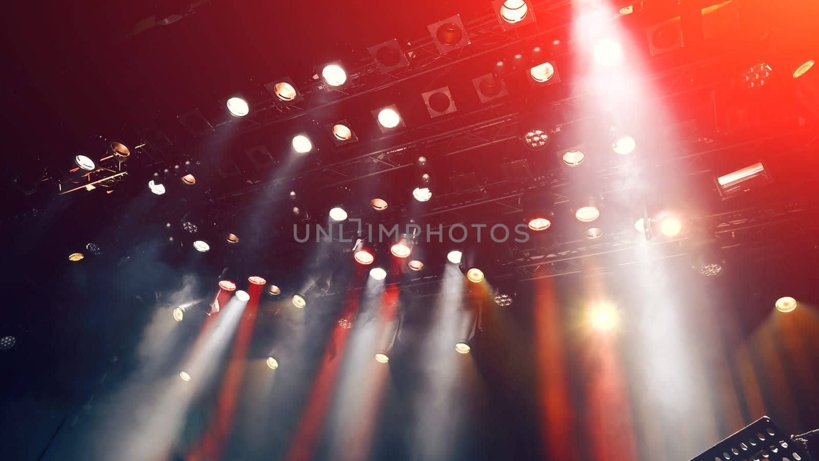 stage lights during the show, concert atmosphere with spotlights and Stage mist