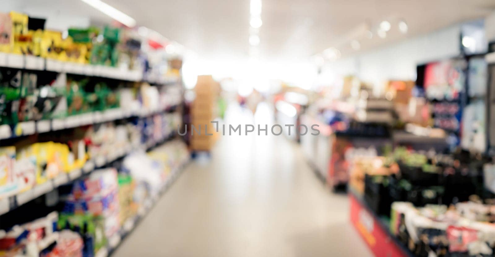 Supermarket shelfs with variety drink bottles. Grocery store aisle with water and juice choice