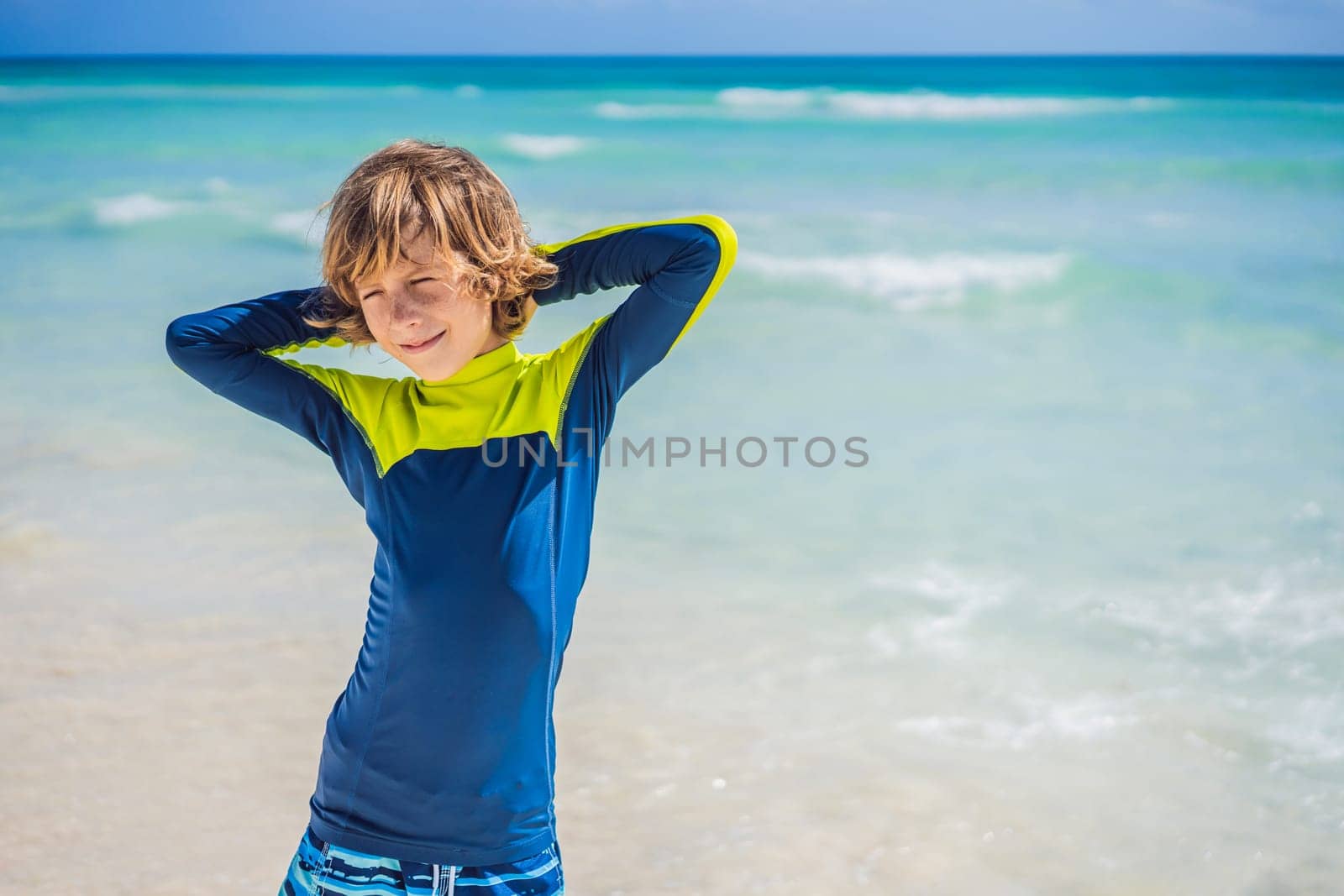 A carefree boy explores the wonders of the beach, with the sun-kissed shoreline as his playground, embodying the spirit of childhood adventure.