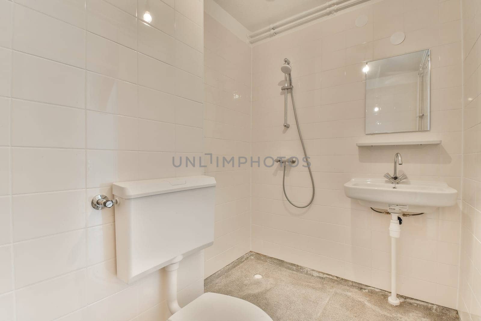 a white bathroom with a shower sink and toilet by casamedia