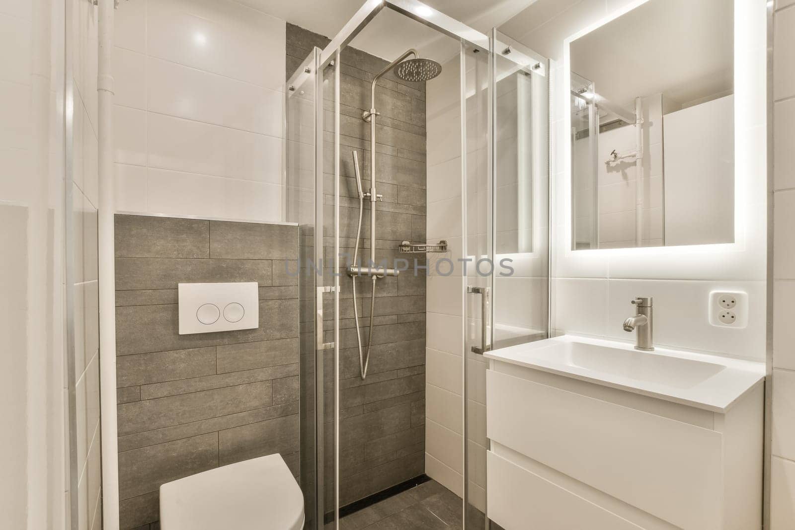 a bathroom with a white sink and toilet in the corner, next to a walk - in shower stall door