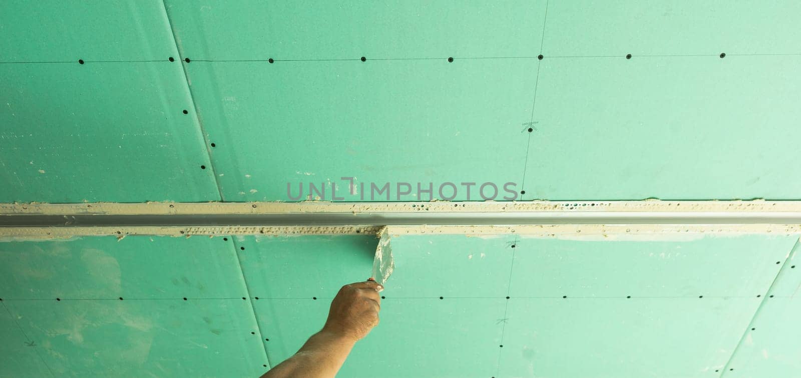 structure of ceiling suspension, installation of gypsum plasterboard and light. by Andelov13