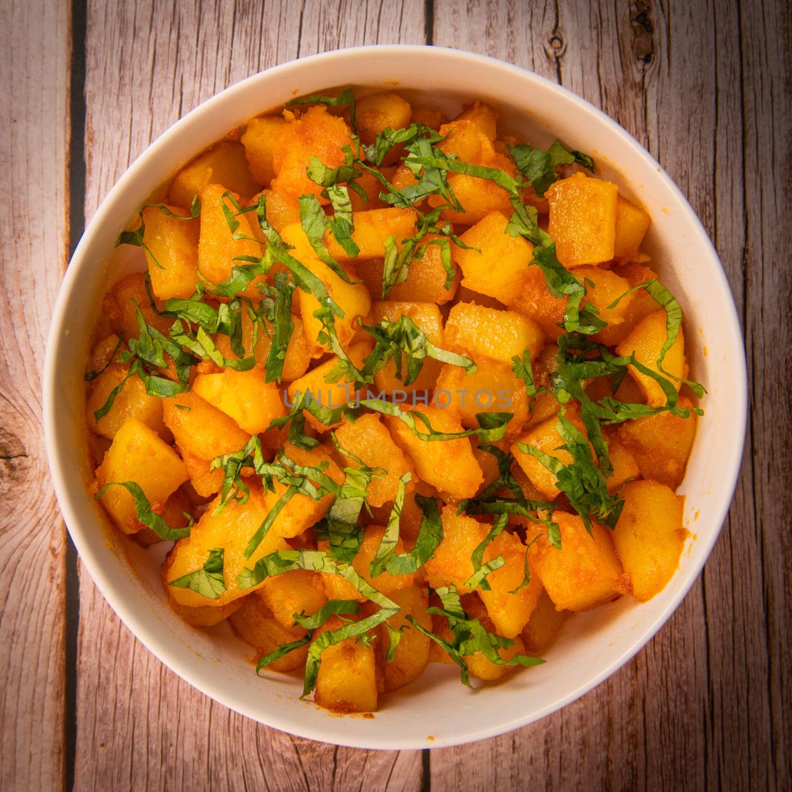 LEBANESE RECIPE FOR SPICY POTATOES, BATTATA HARA, GARLIC, CORIANDER AND PAPRIKA. High quality photo