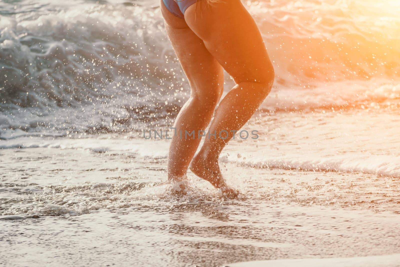 Running woman. Female runner jogging during the sunrise on beach. Woman Runner feet running on the beach at sunrise. woman fitness sunrise jog workout wellness concept.